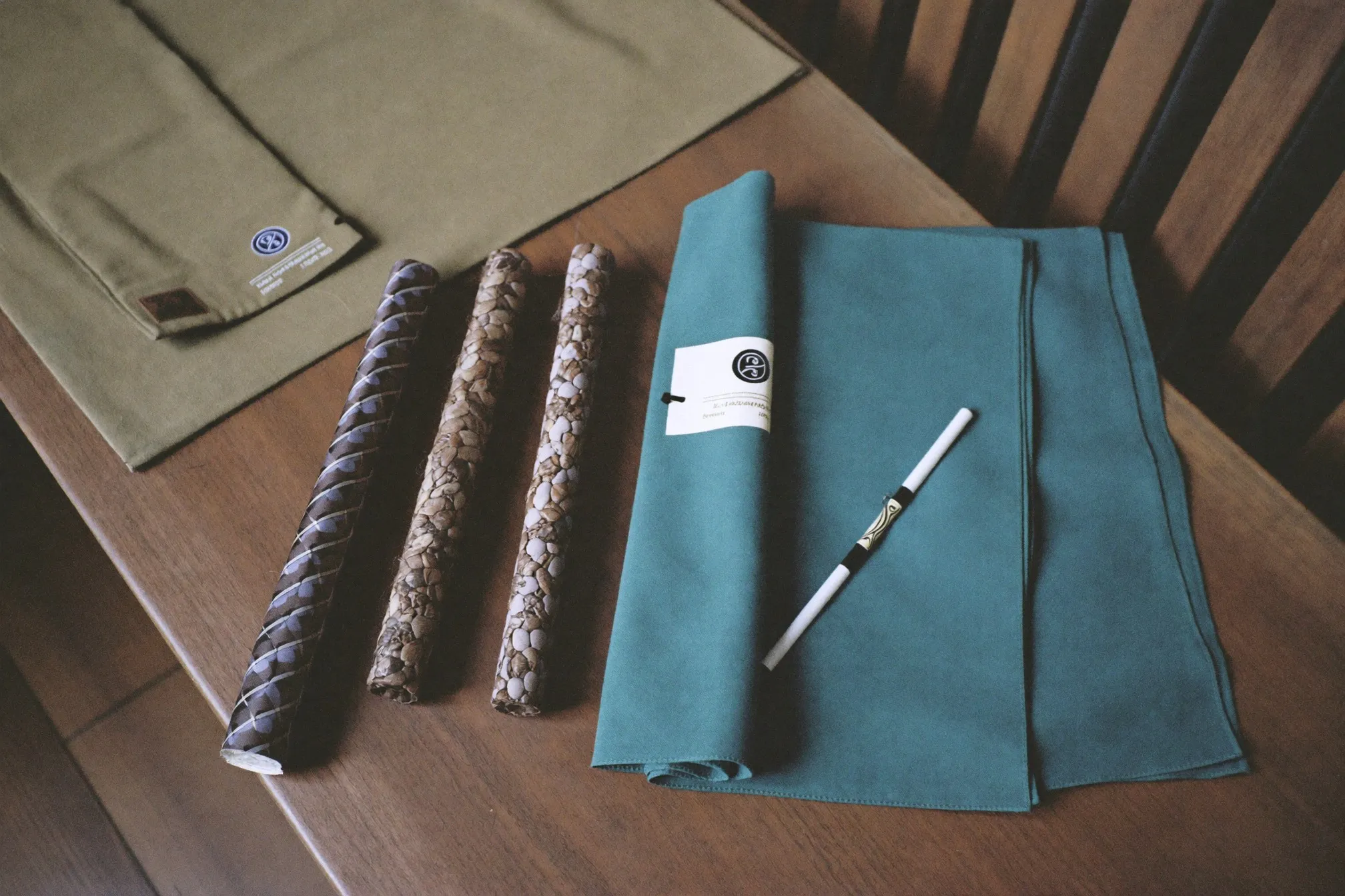 Songket sampin and songkok beside a baju melayu