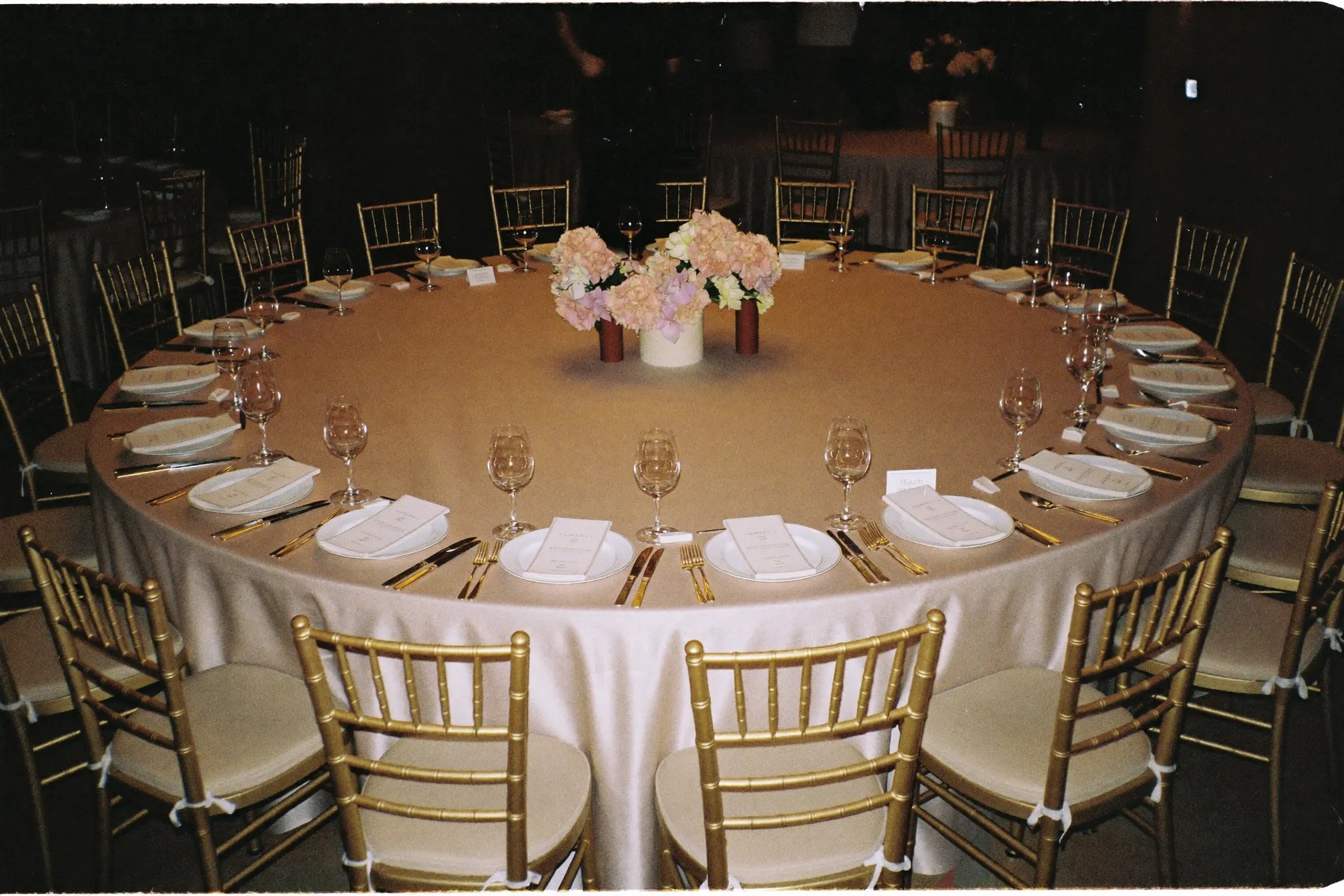 Round banquet table set before guests arrive in a hotel ballroom